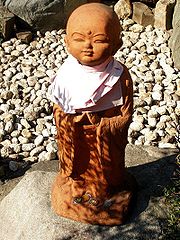 Jizo with coins.jpg